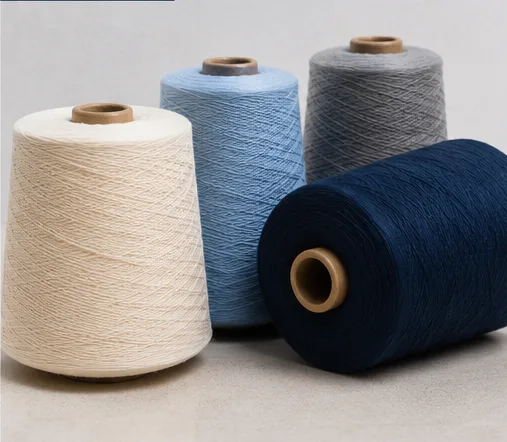 Cream, blue and navy CVC yarn cones
